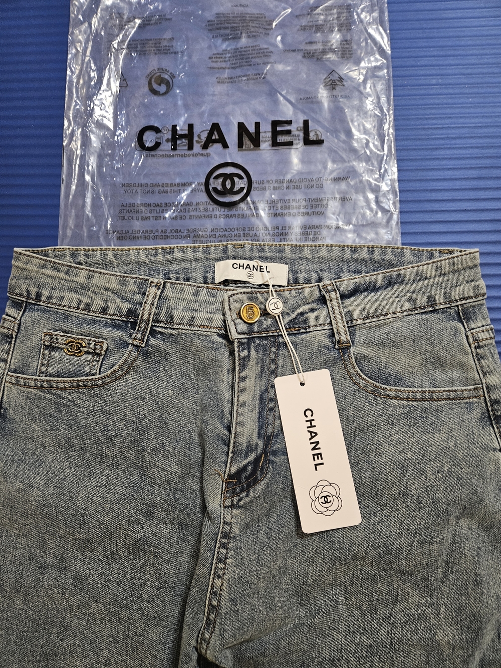Light Blue High-Rise Women’s Jeans with Gold Button Accent - Picture 4 of 9